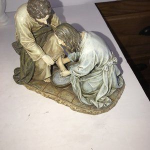 Statueof Jesus Washing Feet of Disciple. Last Supper